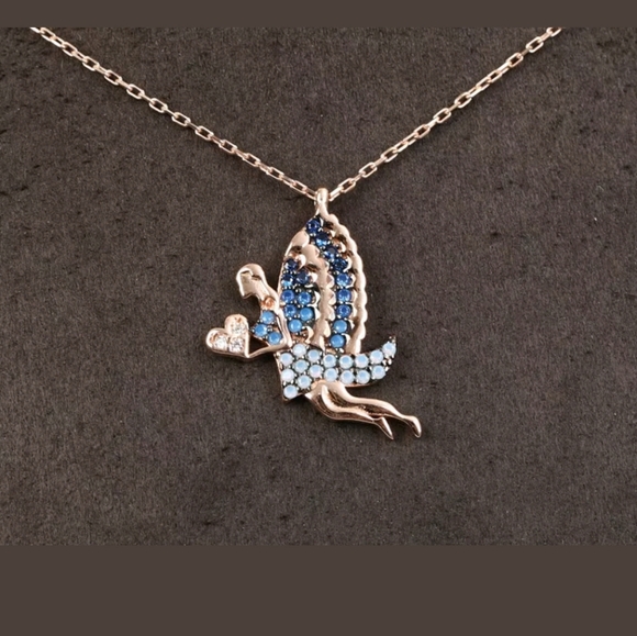 Blue winged fairy holding a white Topaz heart - Picture 4 of 4